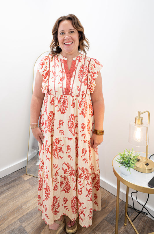 Light red patterned maxi dress with ruffle sleeves.