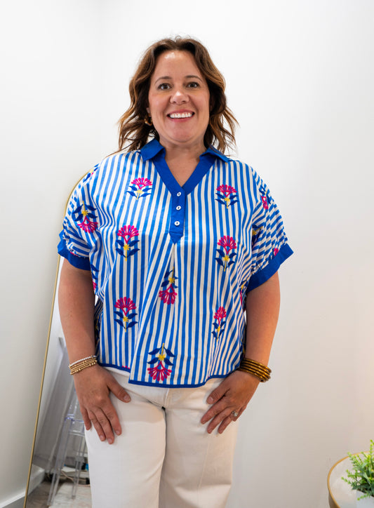 Blue and white collared shirt with pink flowers